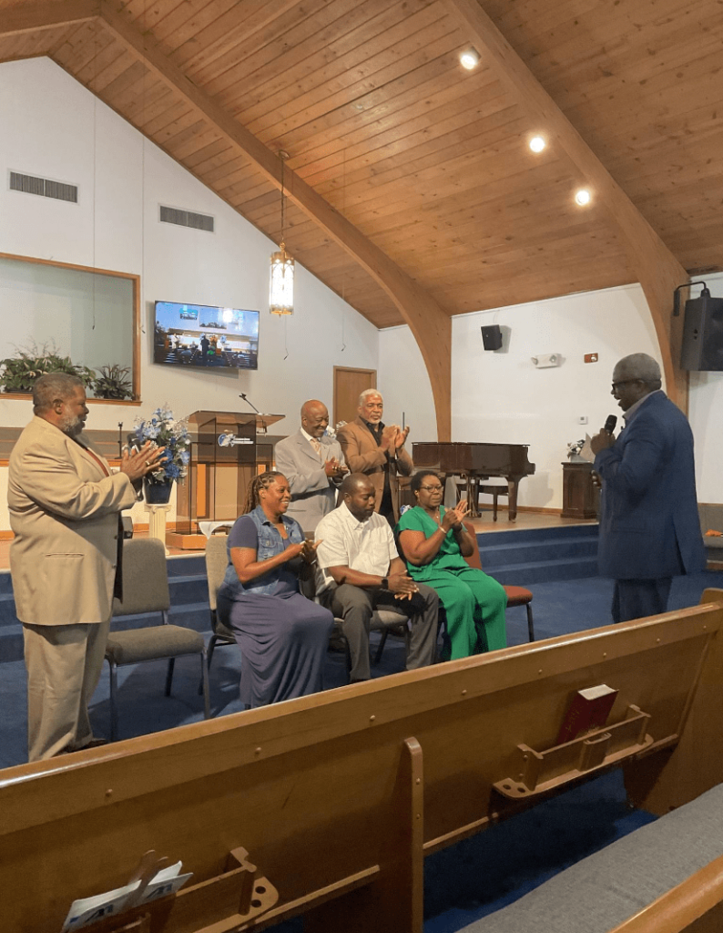 A Diverse Group of Individuals Seated in a Church