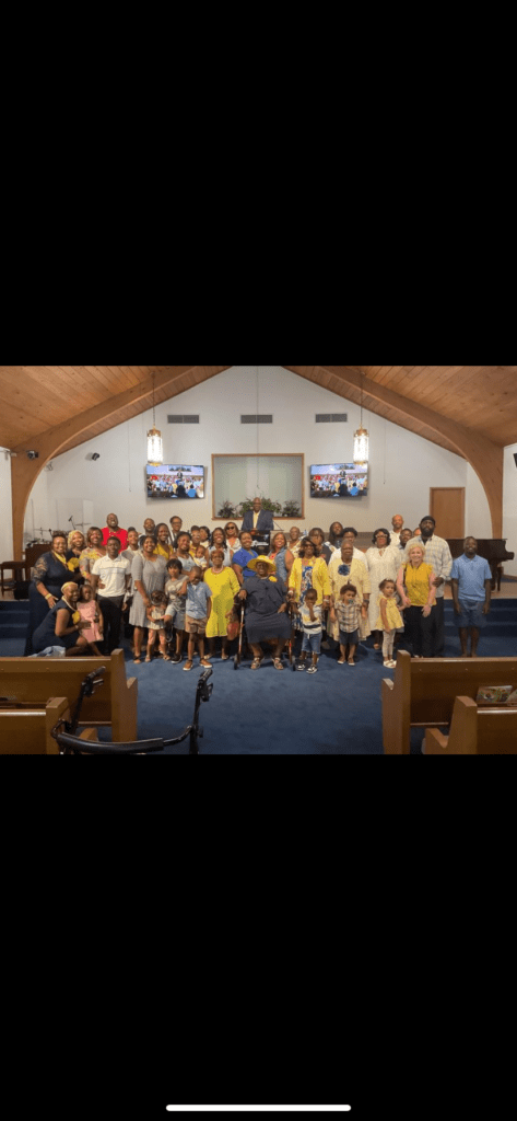 A Diverse Group of Individuals Gathered Inside a Church