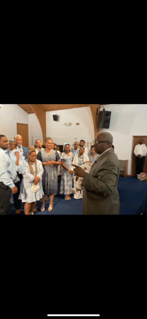 A Diverse Group of Individuals Gathered Inside a Church