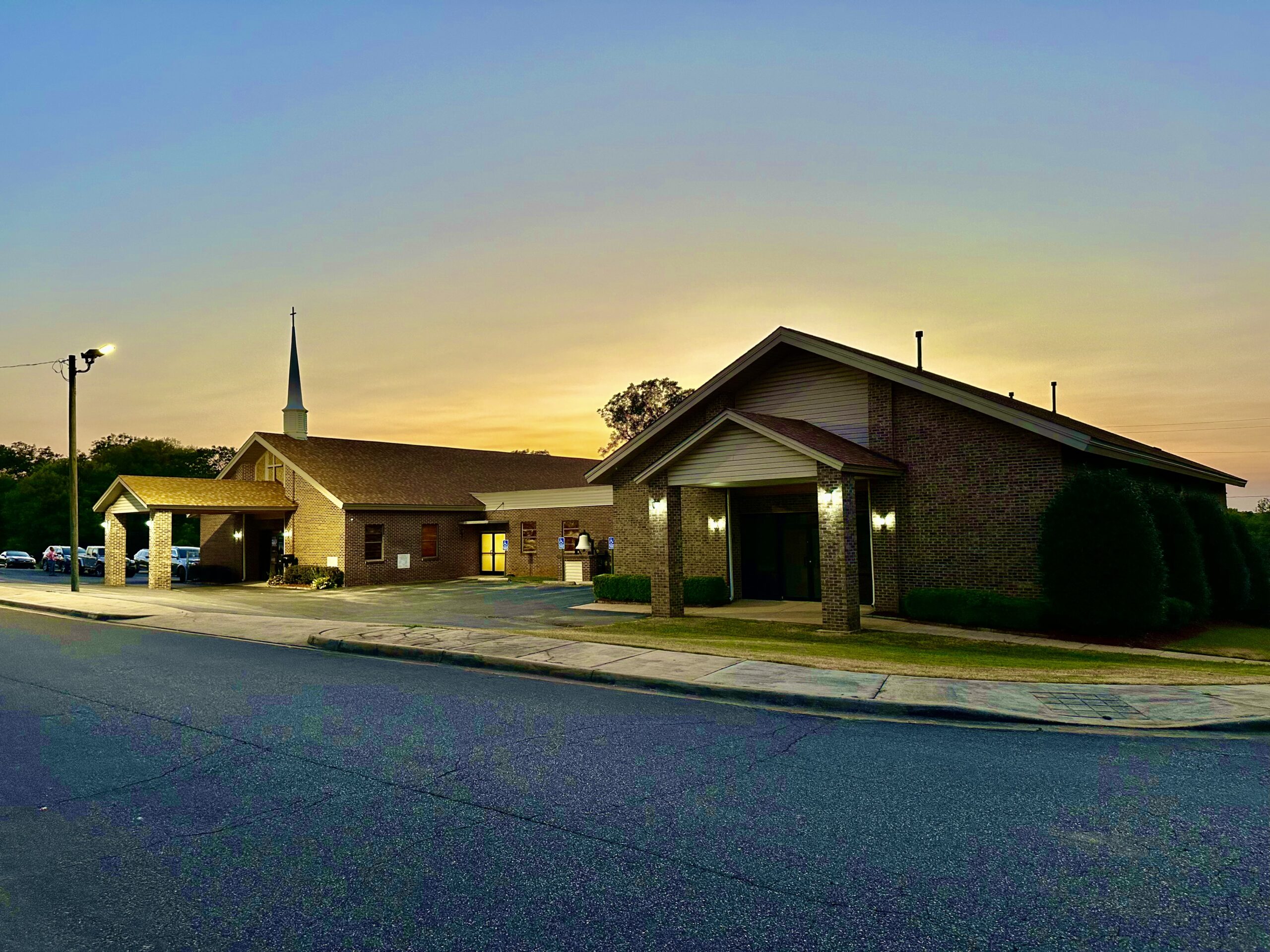 A Church Stands Against the Dusk Sky